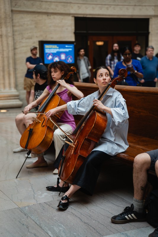 Lia Kohl leads the performance of 'Music for Union Station' inside the Chicago terminal's Great Hall on May 15, 2025. (Ricardo E. Adame | @ricardoeadame)